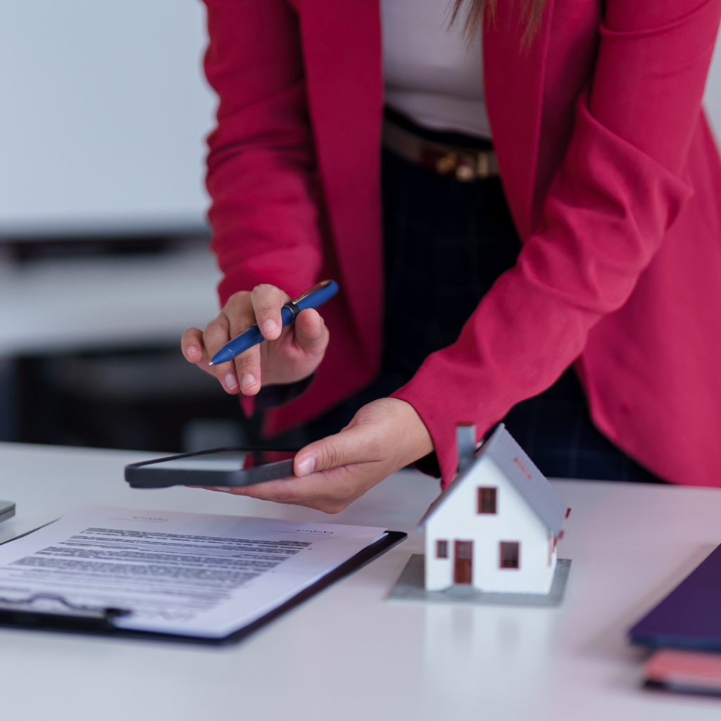 Licensed property managers in Dallas reviewing rental property documents with a landlord