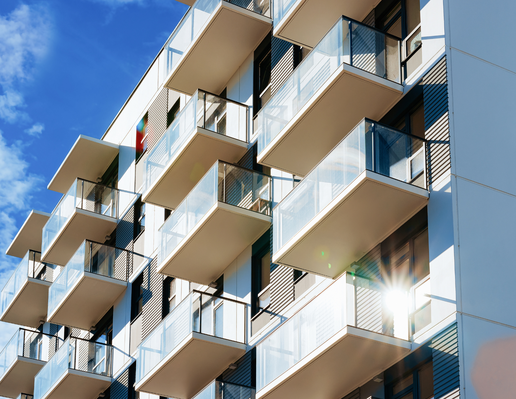 A modern multifamily apartment complex representing a diversified asset class managed through professional real estate investment management in Dallas.