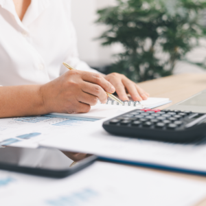 Financial report and calculator representing property accounting services in Texas